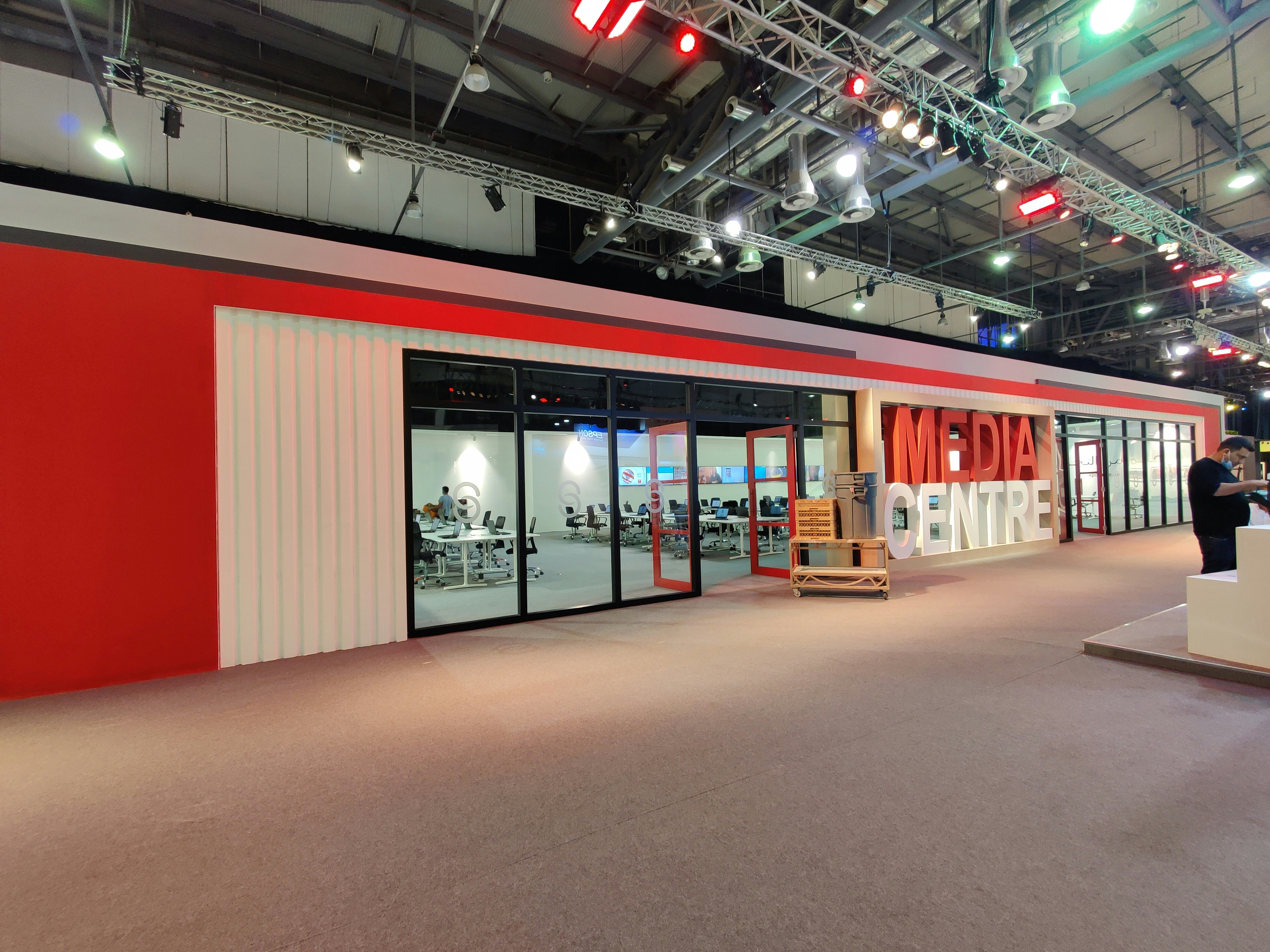 a large room with a red and white wall