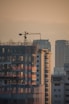 a tall building with a crane on top of it