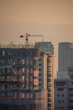 a tall building with a crane on top of it