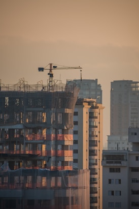 a tall building with a crane on top of it