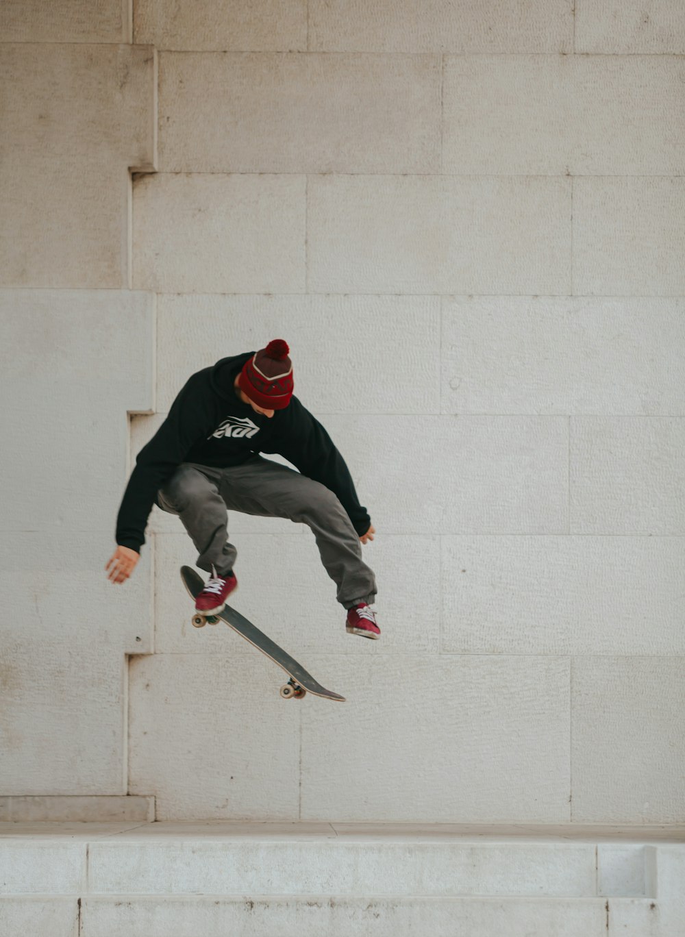 a man flying through the air while riding a skateboard