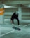 a man doing a trick on a skateboard in a parking garage