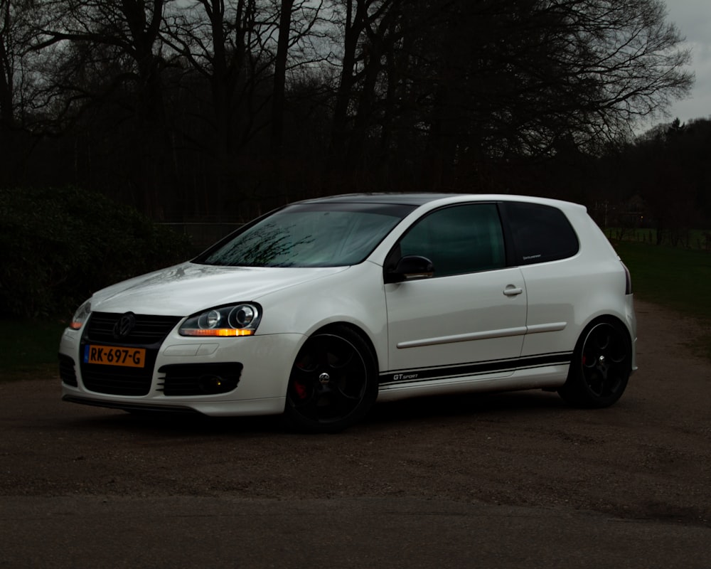 a white car parked in a parking lot