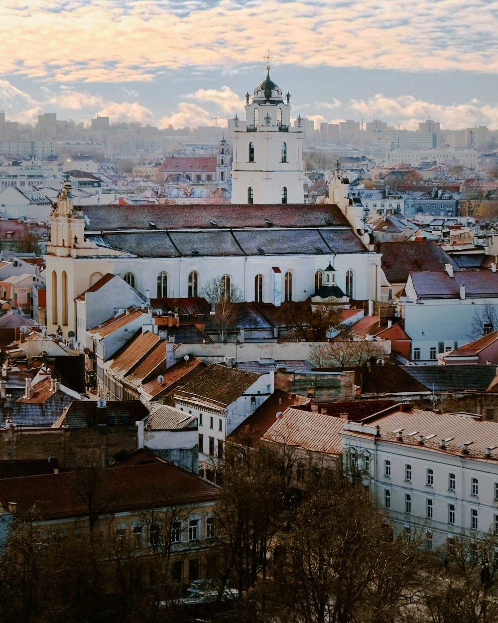 a view of a city with buildings and a clock tower