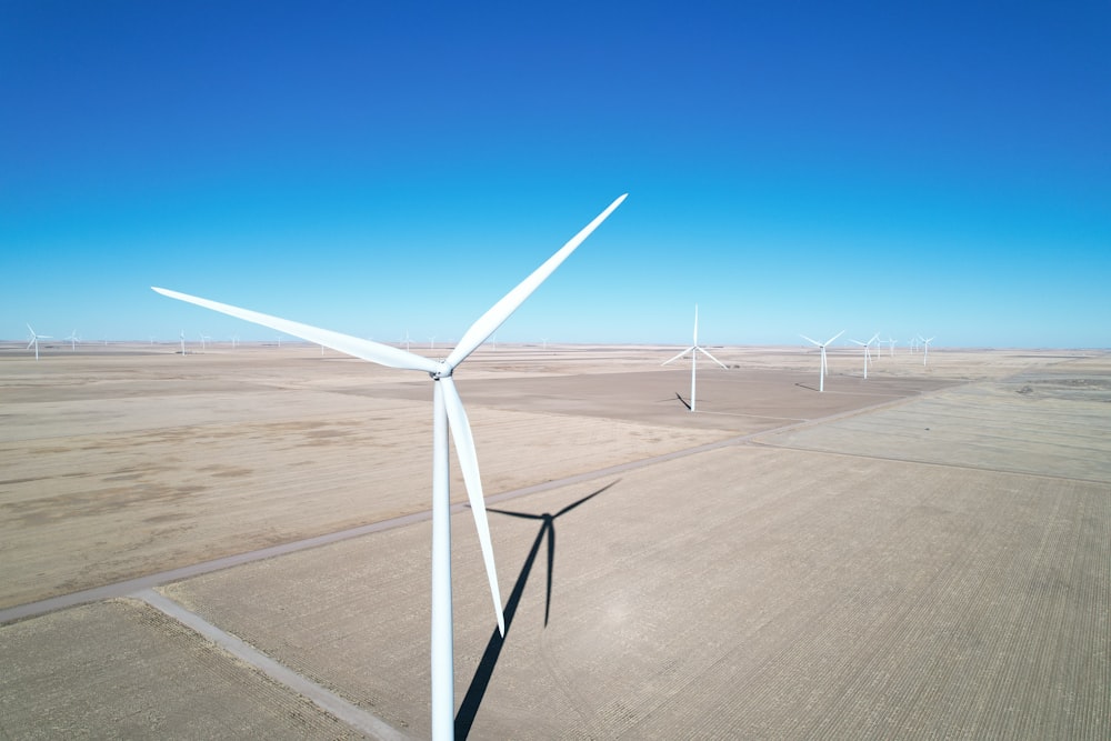 an aerial view of a wind farm in the desert