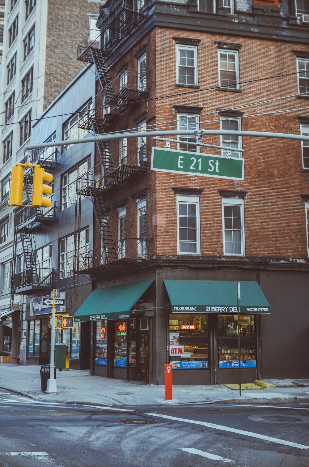 a street corner with a building and a traffic light