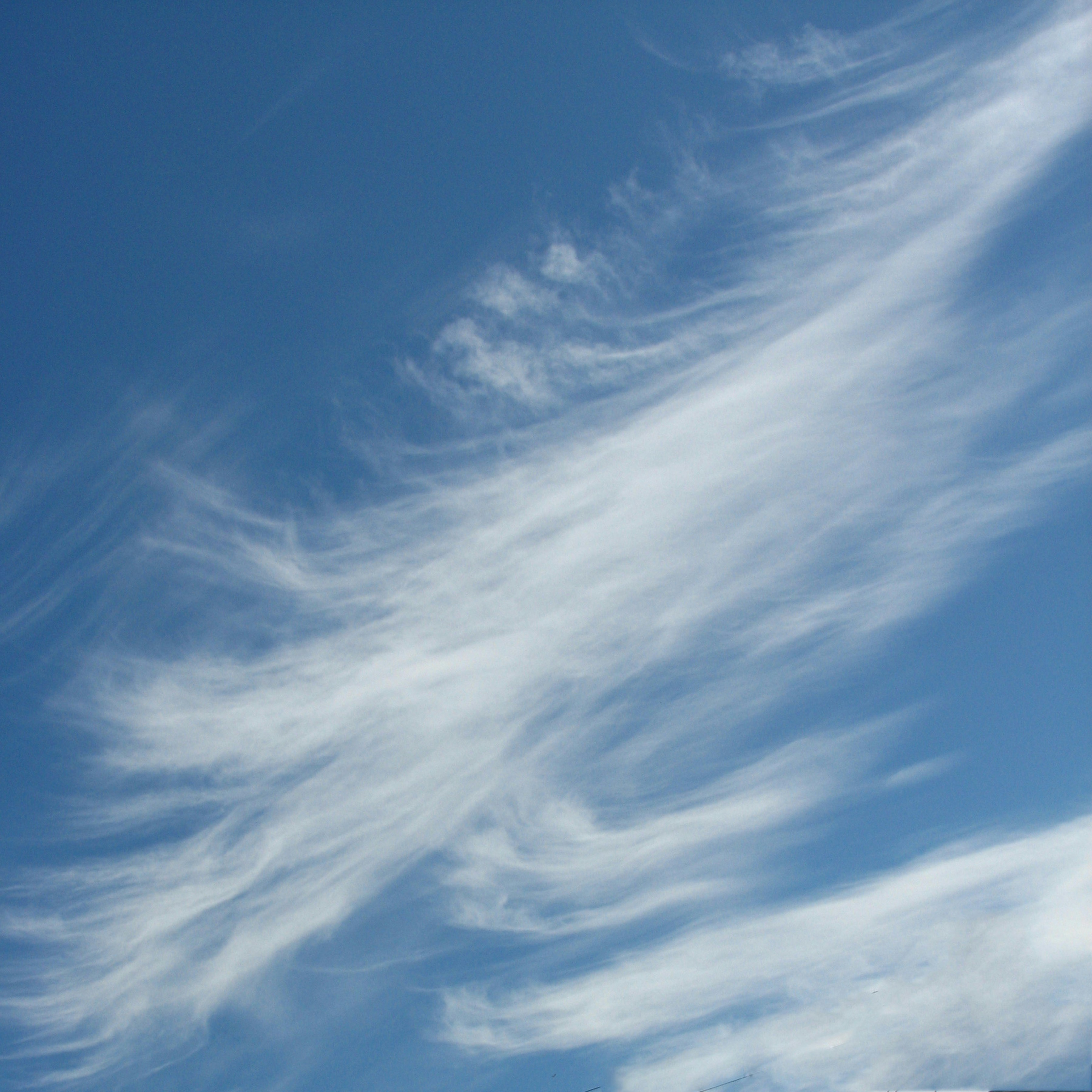a group of people standing on top of a snow covered slope