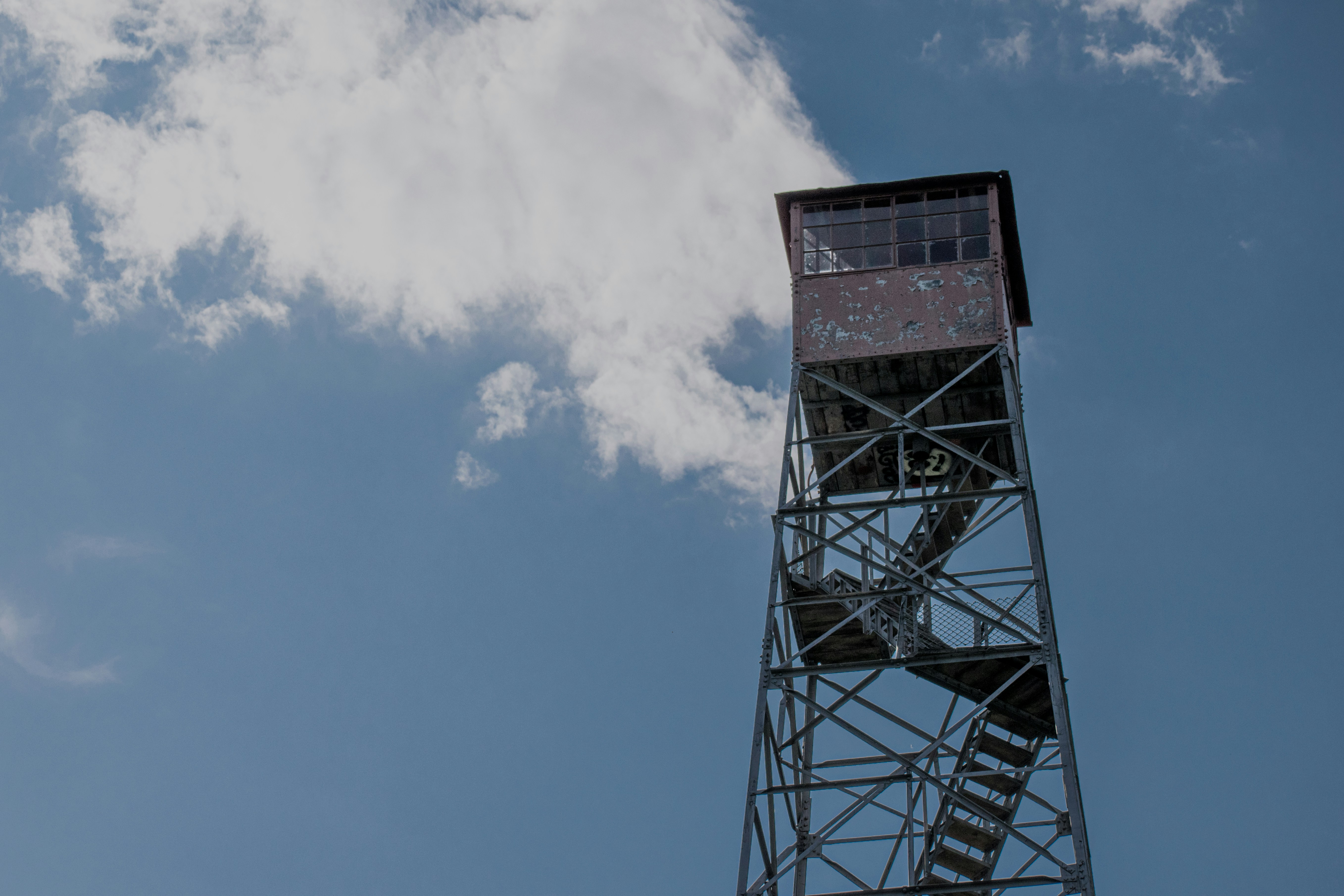 a tall metal tower with a clock on top