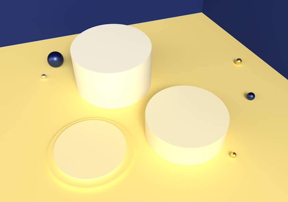 a yellow surface with two round objects on it