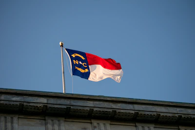 a flag flying on top of a building