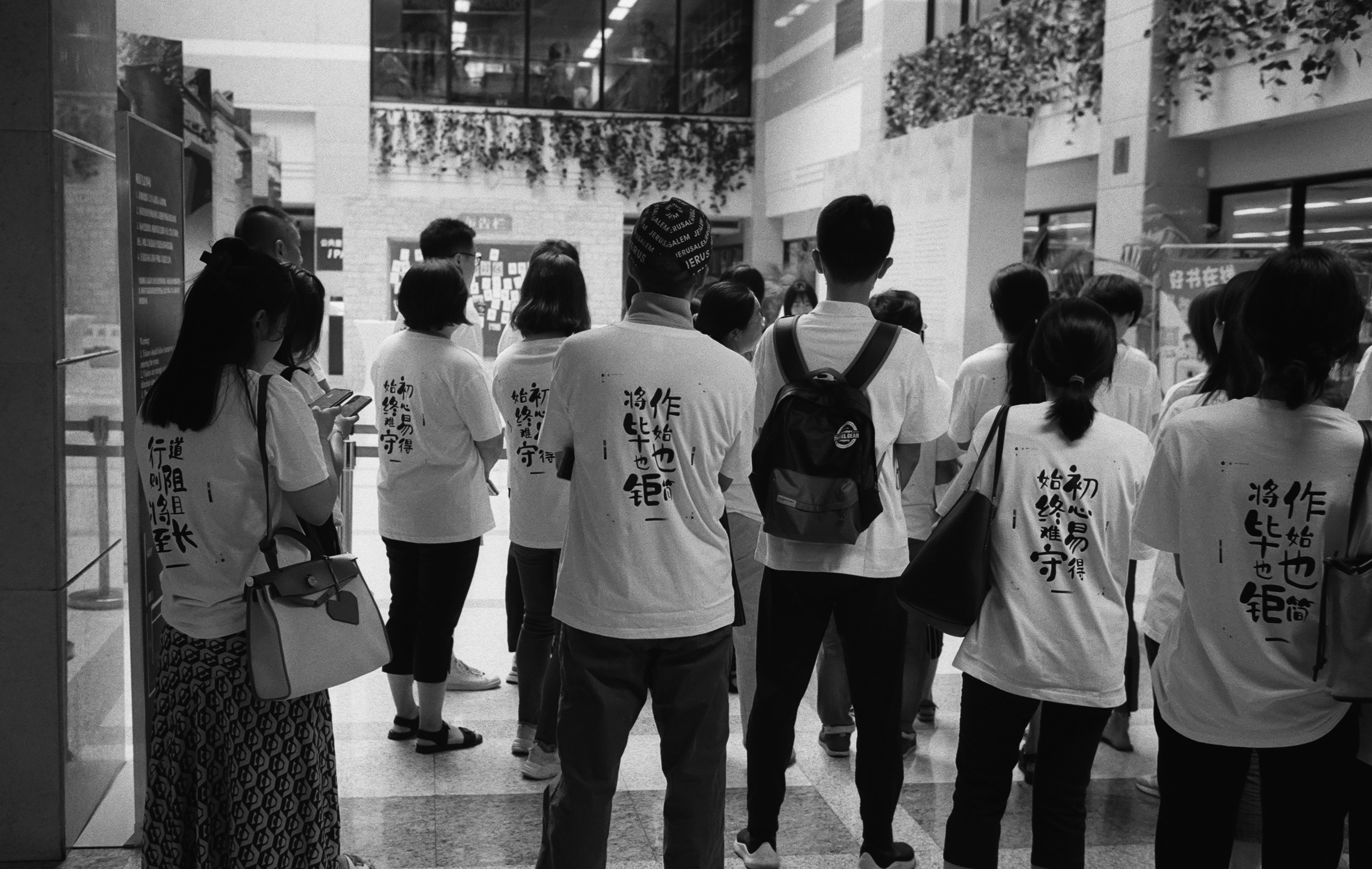 a group of people standing around each other