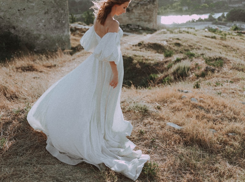 Graceful woman in white in nature