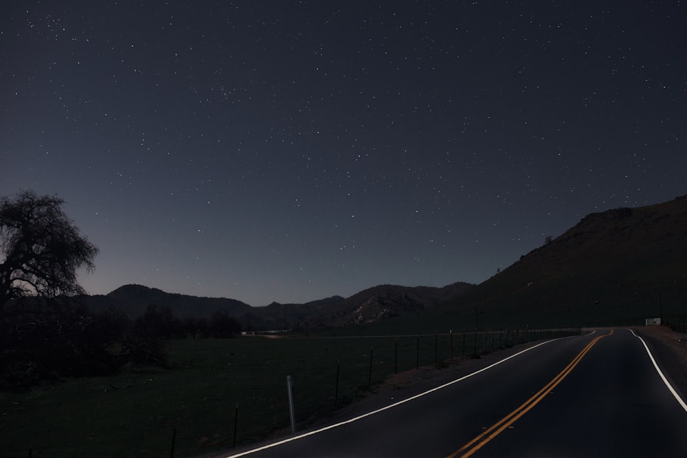 a road with a mountain in the background