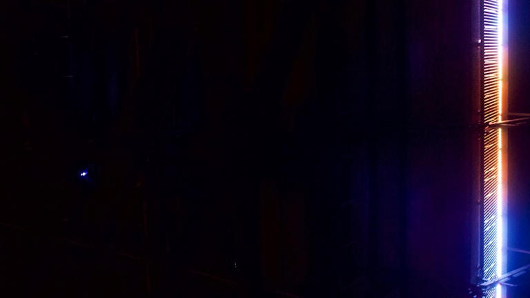 Dynamic shot of a vertical music video scene with vibrant lighting.