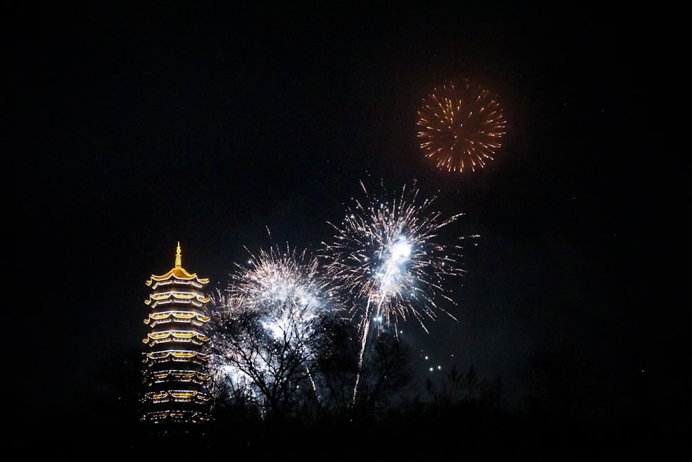 fireworks are lit up in the night sky