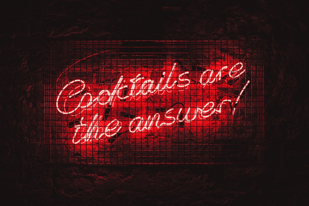 a neon sign that says capitalism is the answer