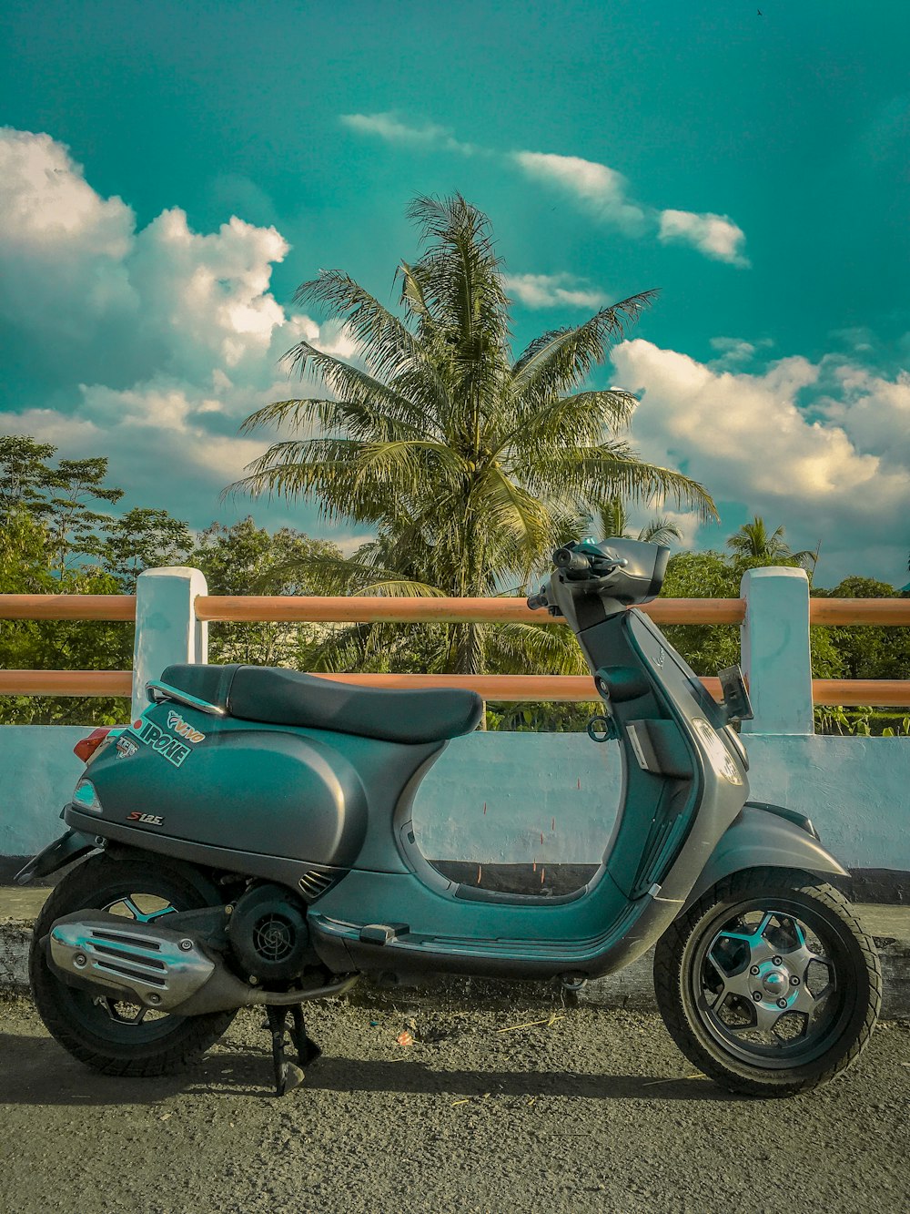 a scooter parked on the side of the road