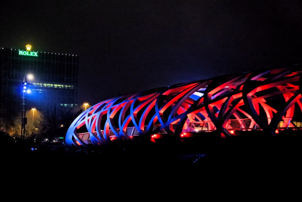 a stadium lit up with red and blue lights