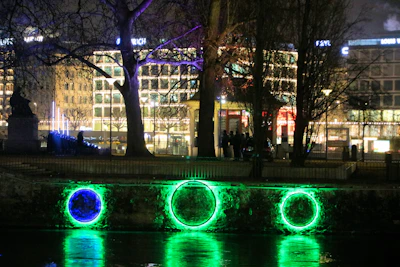 Nighttime cityscape with new sustainable lighting installations.