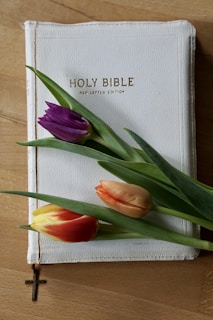 a book with a bunch of flowers on top of it