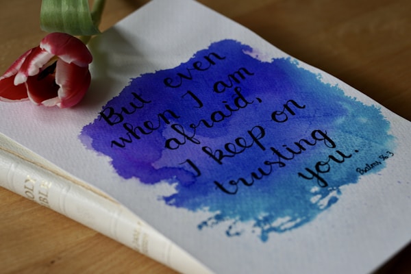 a flower sitting on top of a piece of paper