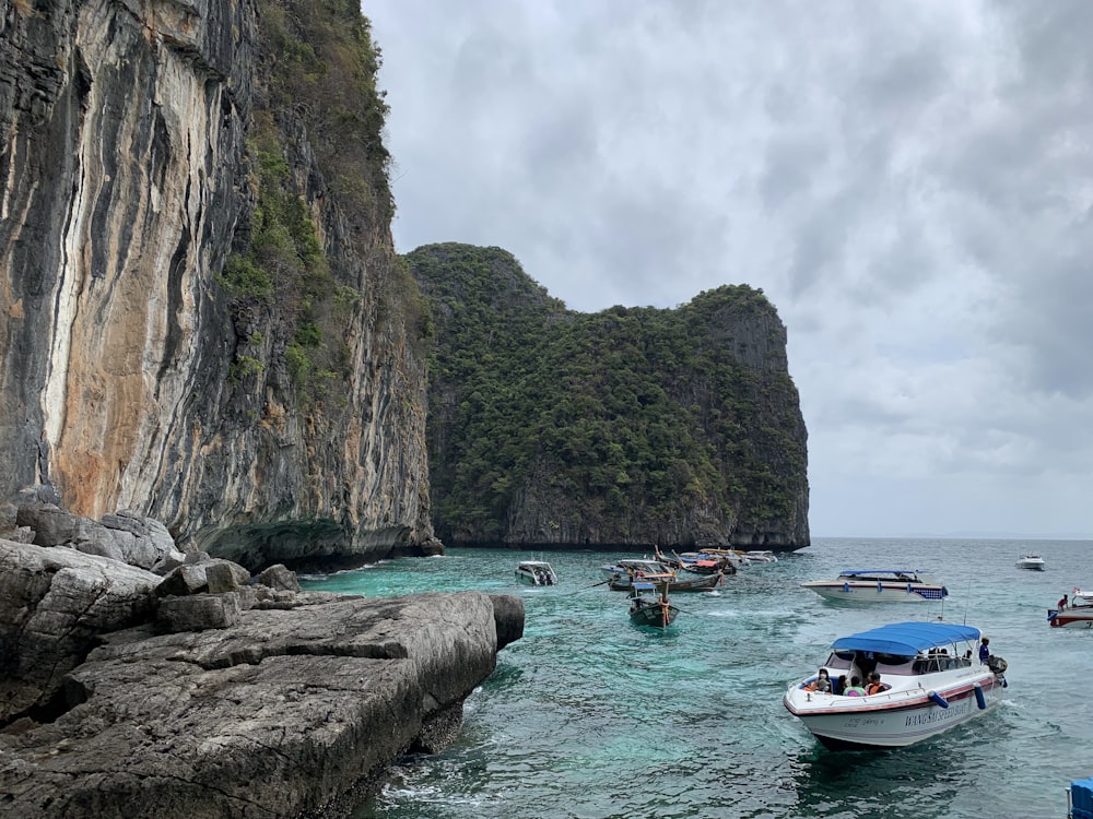 a number of small boats in a body of water