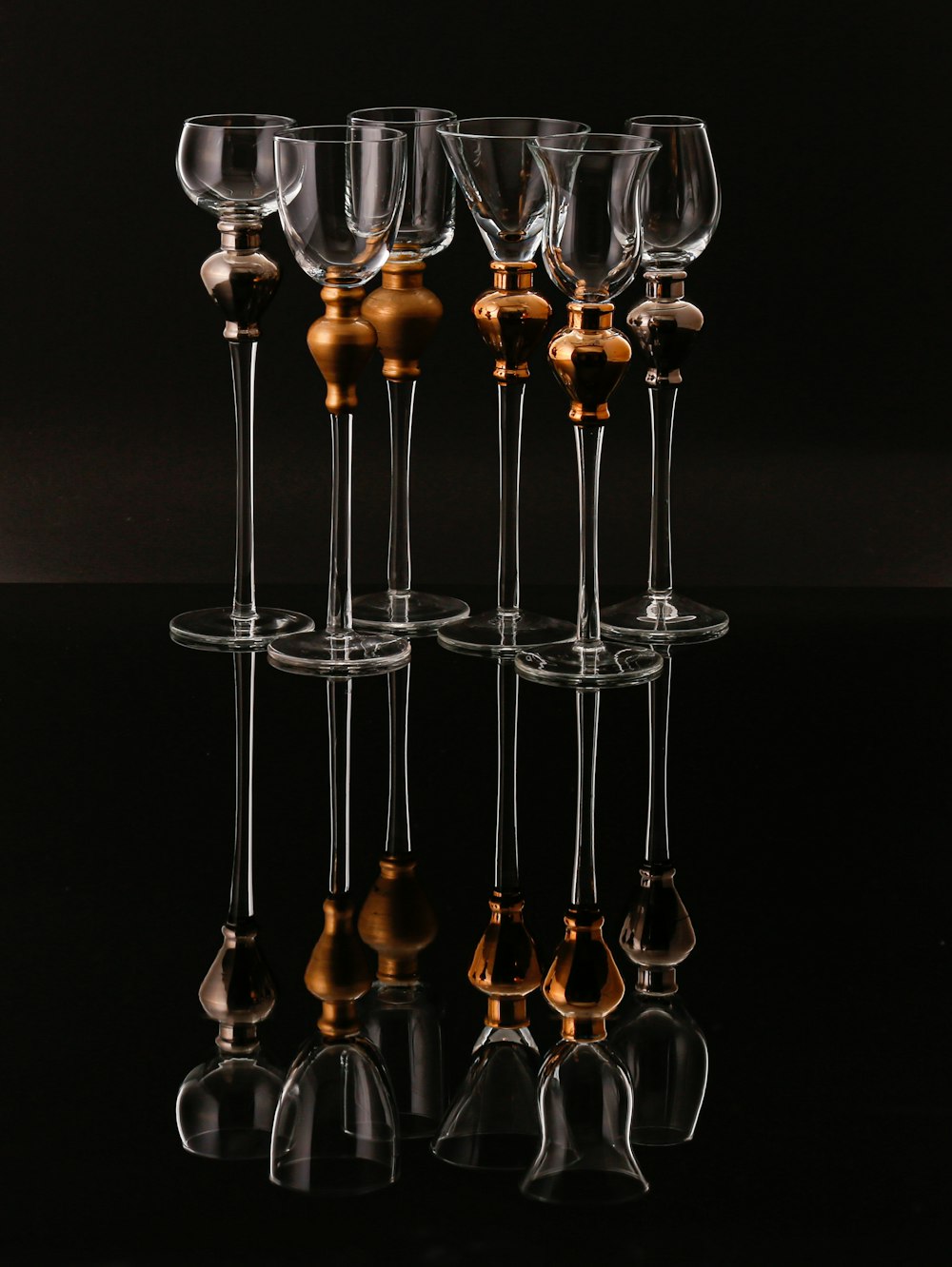 a group of wine glasses sitting on top of a table