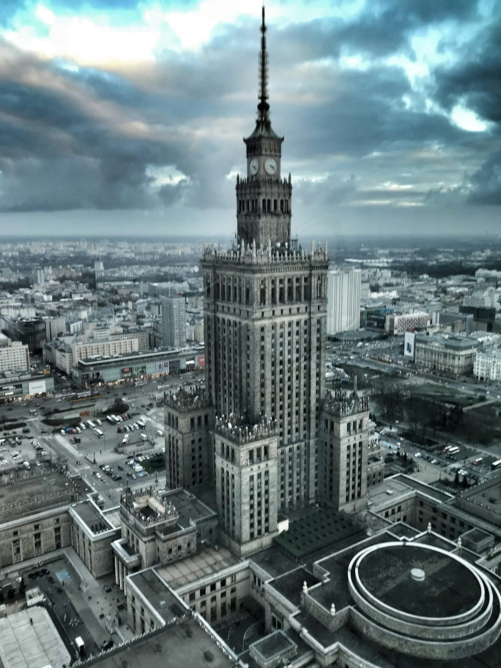 an aerial view of a large building with a clock tower