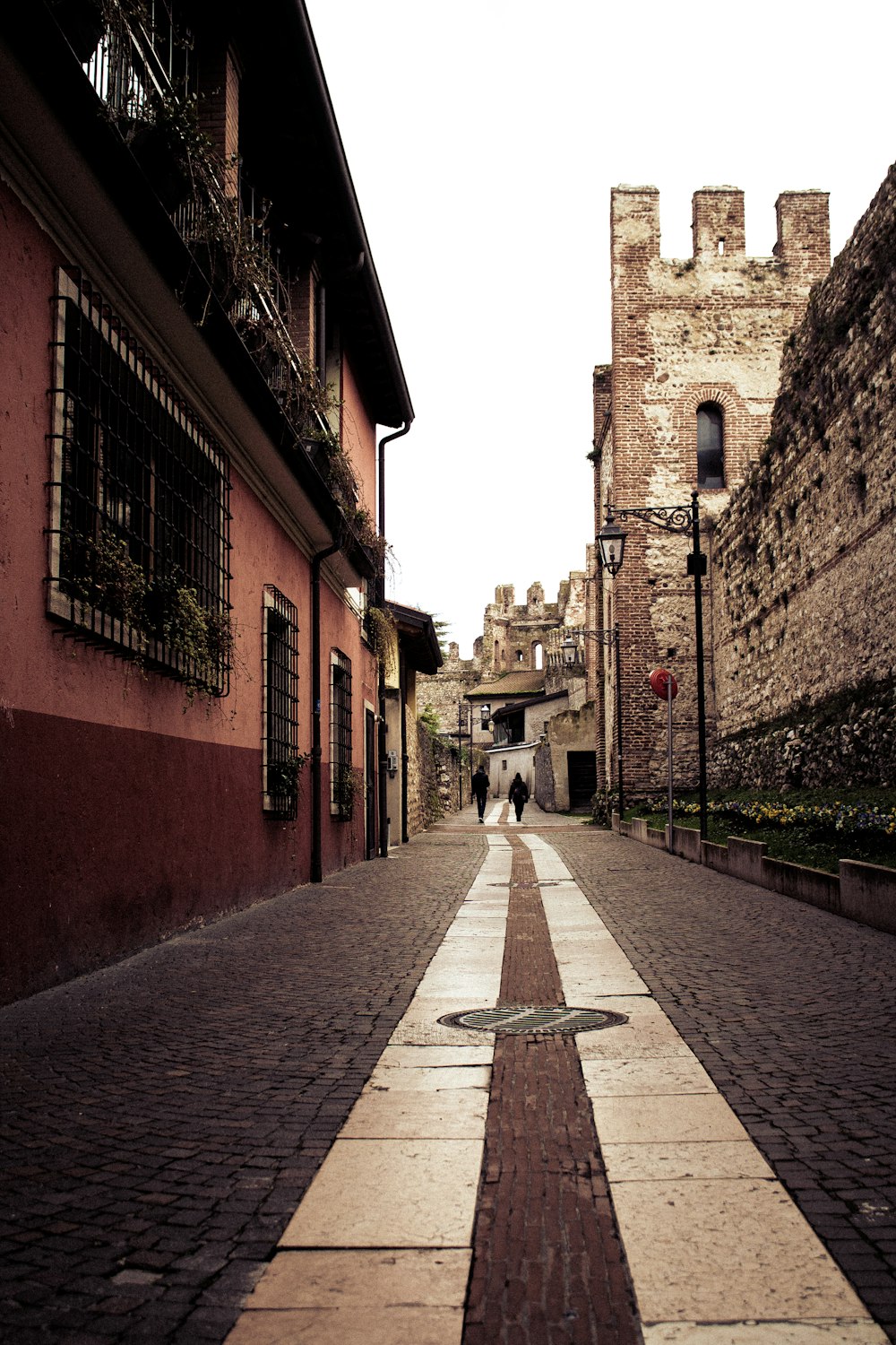 a narrow cobblestone street in an old city