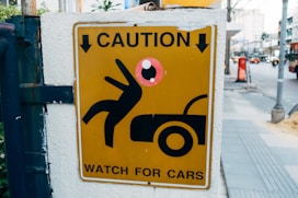 a caution sign on the side of a building