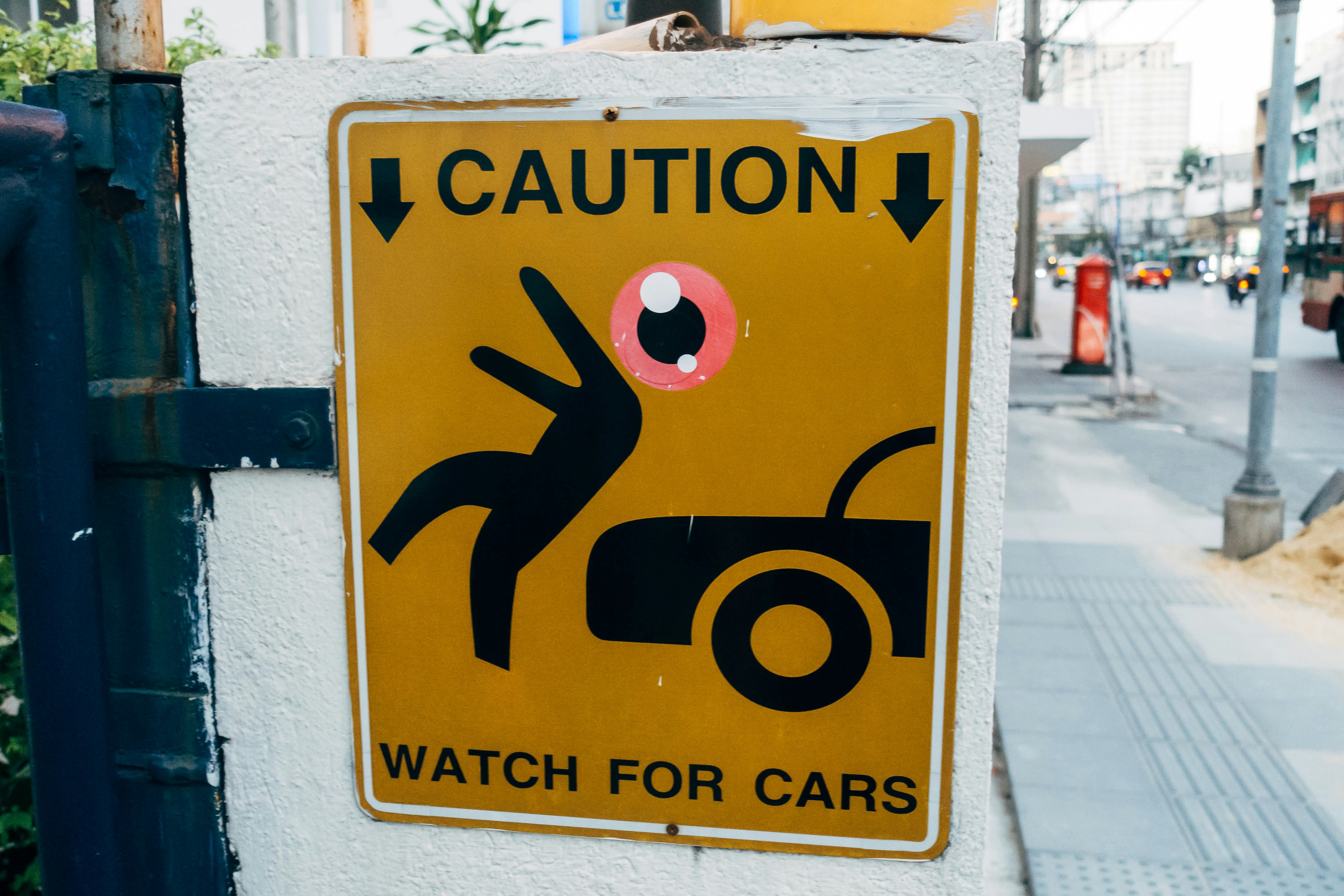 a caution sign on the side of a building