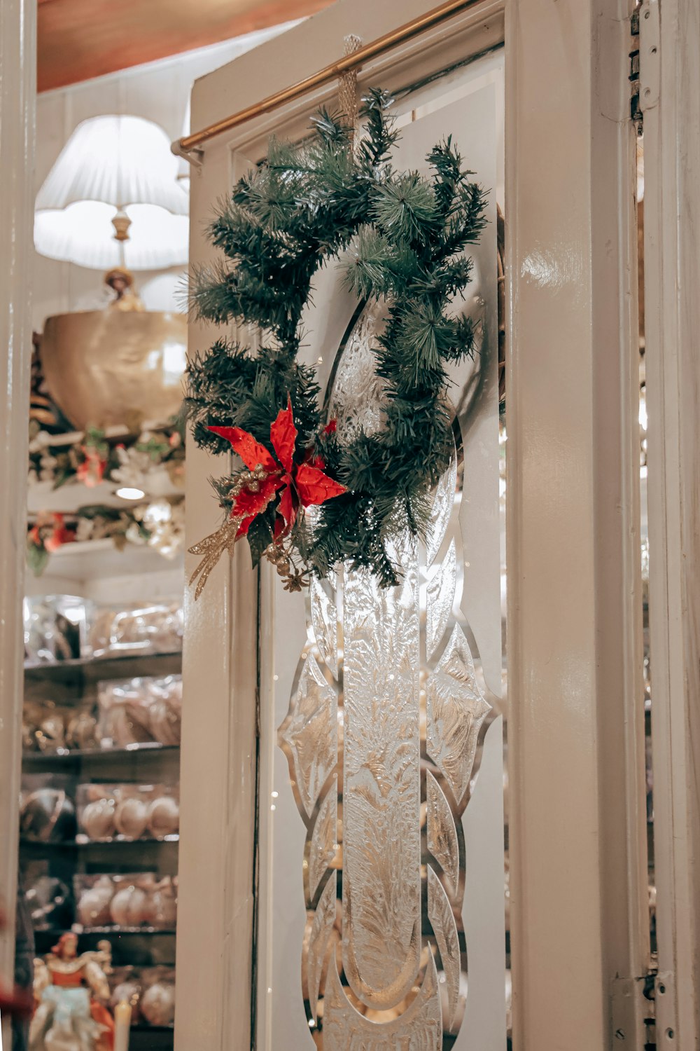 a christmas wreath hanging on a door