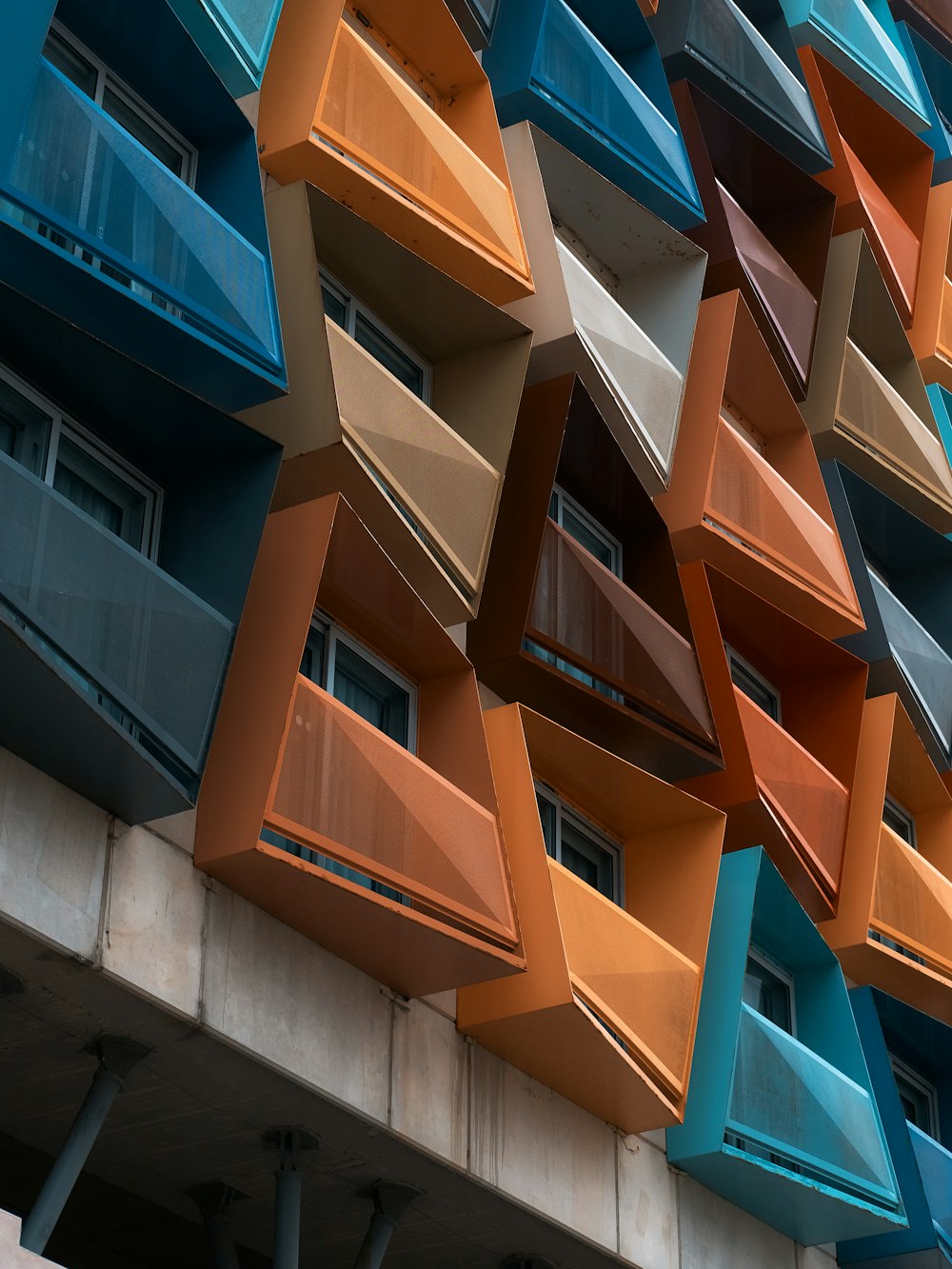 a multicolored building with balconies and balconies on the side