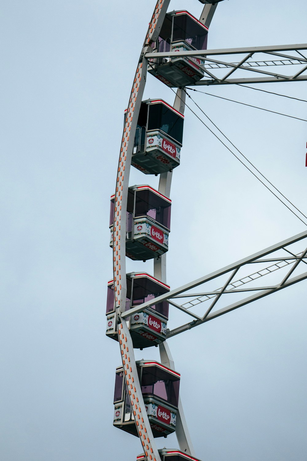 a ferris wheel with a flag flying in the background