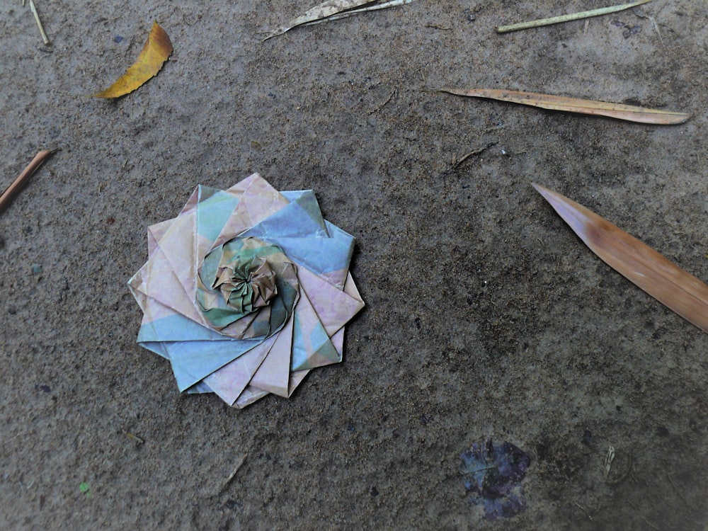 a piece of origami sitting on the ground