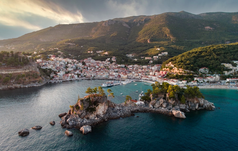 an aerial view of a town on a small island in the middle of the ocean