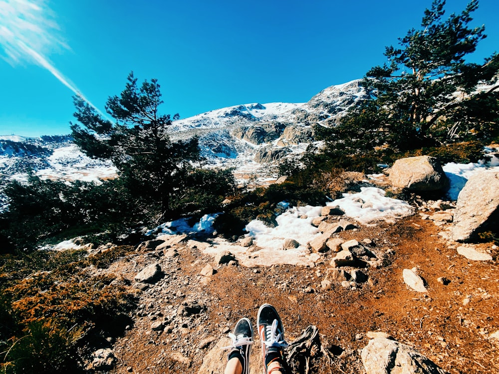 a person standing on top of a rocky mountain