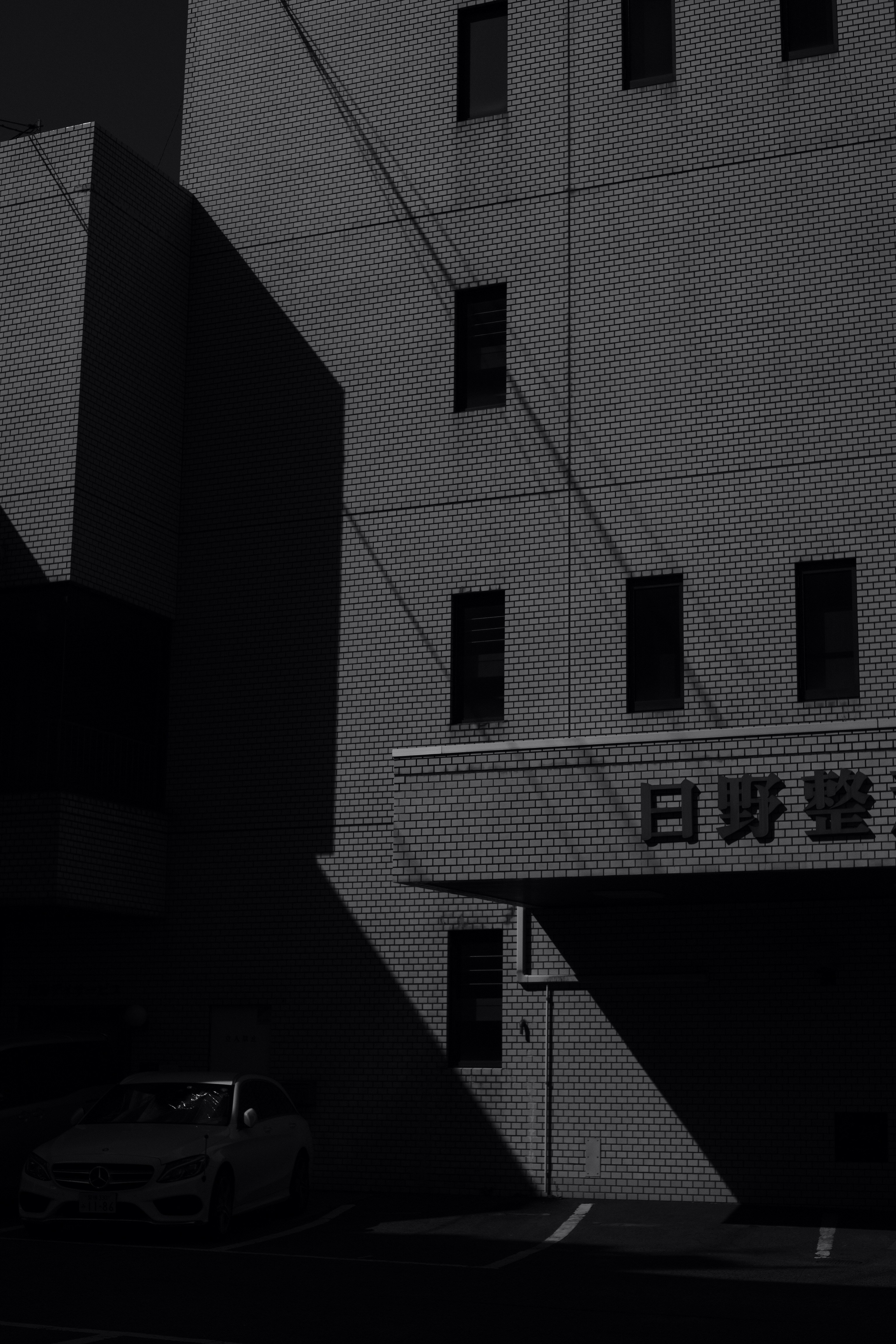 a car is parked in front of a building