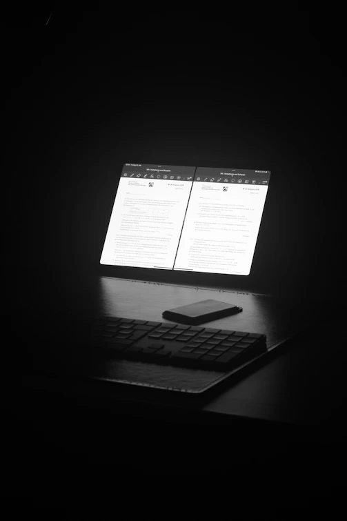 a laptop computer sitting on top of a desk