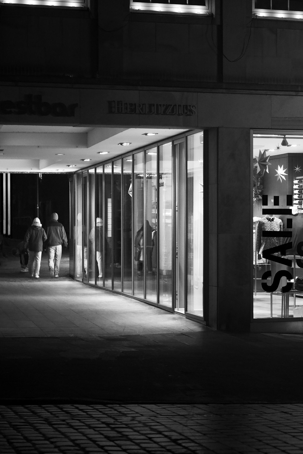 a black and white photo of a store front