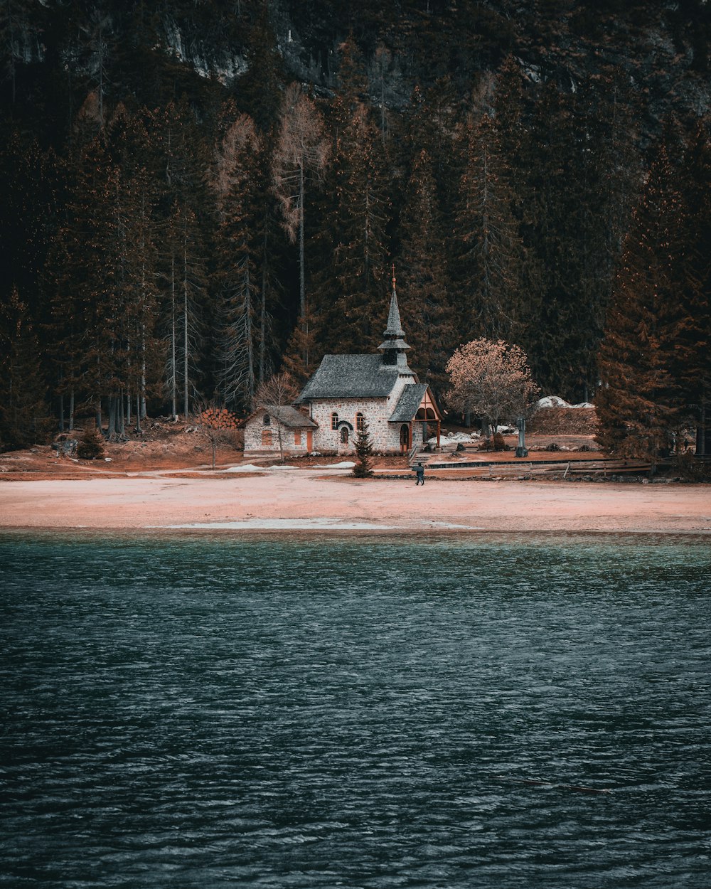 a church on the shore of a lake