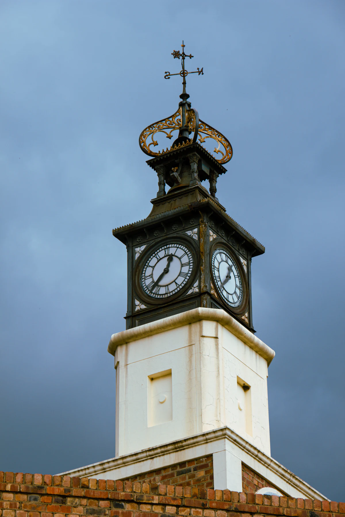 Clock tower with a cross on top