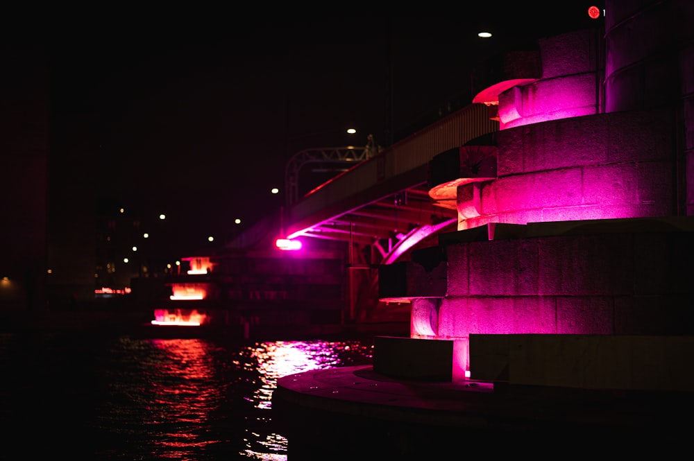 a bridge over a body of water at night