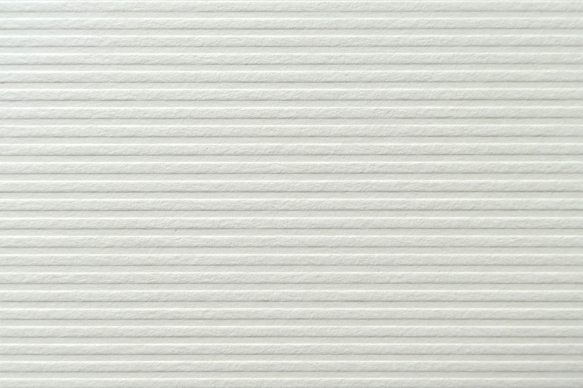 a close up of a white textured wall