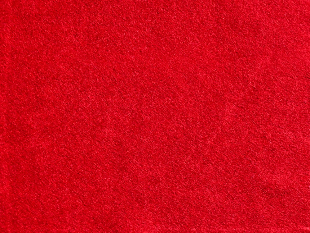 a close up of a red area rug