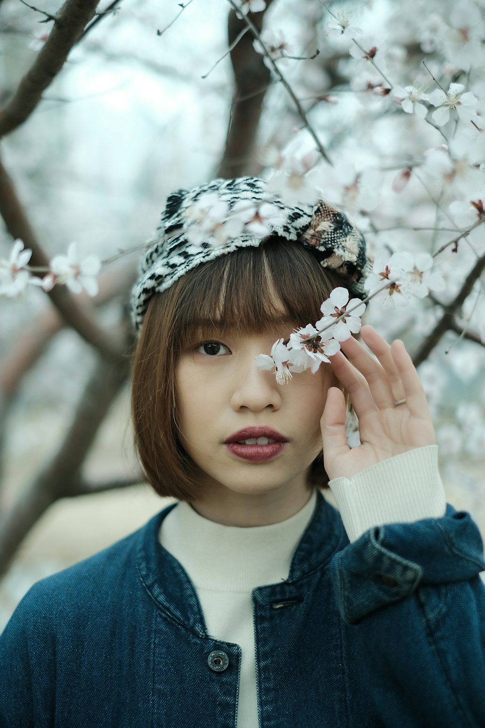 a woman with a flower in her hair