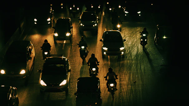 a street filled with lots of traffic at night