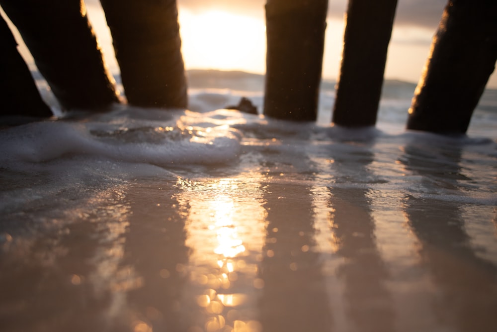 a close up of the sand and water on a beach