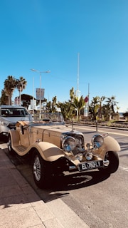 an old car parked on the side of the road