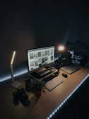 Minimalist workspace showcasing printed samples with rich colors under soft light.